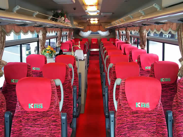 A large bus with a toilet An interior image